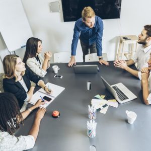 Office brainstorming, people sitting at desk